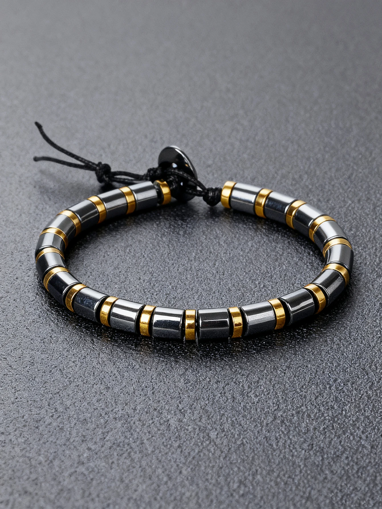Hematite Stone Bracelet with Gold Spacers and Leather Cord - Image 1
